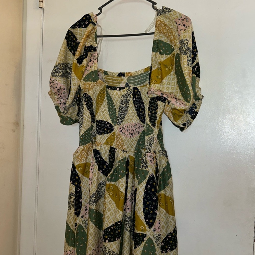 A very long mixed color beautiful dress.